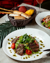 vegetable salad with fried sliced meat