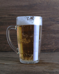 glass of cold beer with foam