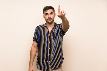 Handsome man with beard over isolated background touching on transparent screen