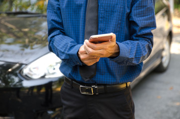 man holding smartphone hands and touching screen of modern mobile phone.