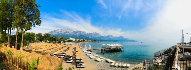 Naklejka premium Kemer, Antalya/ Turkey - summer 2019: Beach of Turkiz hotel ( now Imperial Turkiz) first plain, and others on back ( Panoramic )