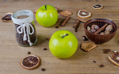 Cinnamon sticks, green apple, nuts, coffee grains and dried fruits