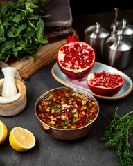 vegetable soup topped with pomegranate