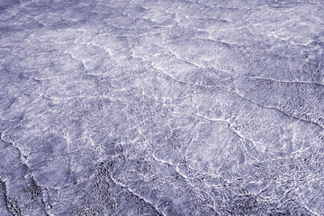 Pattern of sea waves toned in gray blue and white