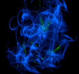 Conceptual image of blue smoke isolated on dark black background.
