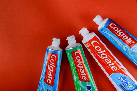 Isolated with red background of Colgate toothpaste is produced and manufactured by the Colgate Company.