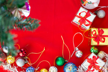 Christmas decorations on red background. Top view, flat lay.