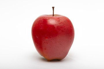 Red apple, close-up, isolated on a white background.