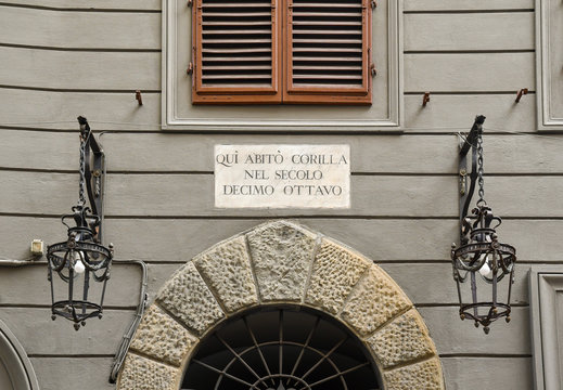 Detail of the fa&ccedil;ade of an old palace with the inscription "Here lived Corilla in the eighth century" dedicated to the poetess Maria Maddalena Morelli, know as "Corilla", Florence, Tuscany, Italy