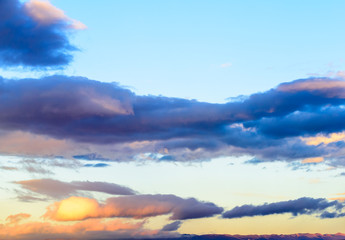 Dramatic puffy clouds at sunset