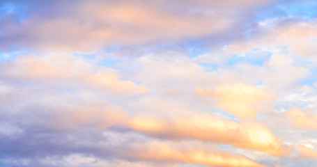 Dramatic puffy clouds at sunset