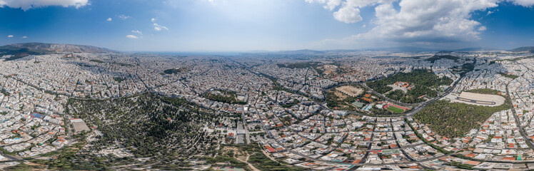 Aerial panoramic drone shot of Athens Pangari district with Acropolis, Olympion Zeus temple, Zappeion hall