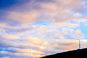 Dramatic puffy clouds at sunset
