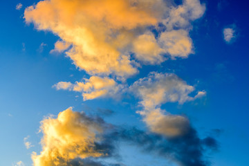 Dramatic puffy clouds at sunset