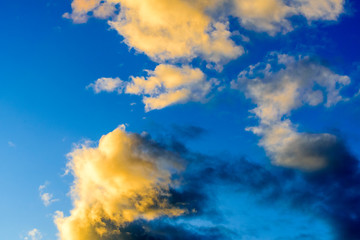 Dramatic puffy clouds at sunset