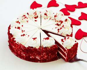 a piece of delicious red velvet cake on a plate.