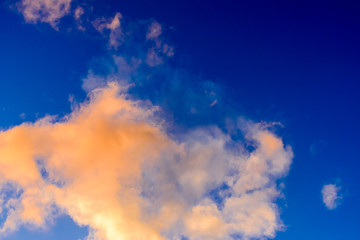Dramatic puffy clouds at sunset