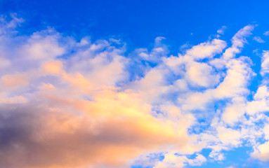 Dramatic puffy clouds at sunset