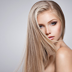 Pretty face of young woman with long white hair