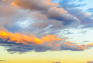 Dramatic puffy clouds at sunset