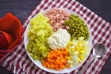 Home cuisine Olivier salad, closeup photo. To the festive table.