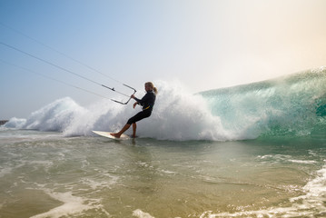 The kite surfer rides the waves of the Atlantic Ocean