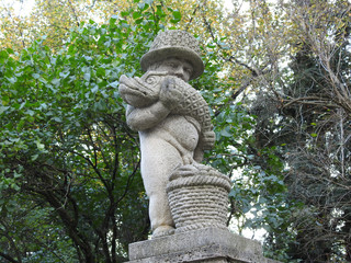 Statue of a boy with a fish in the park