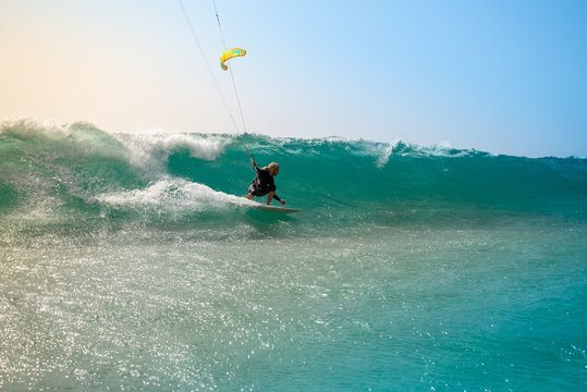 The kite surfer rides the waves of the Atlantic Ocean