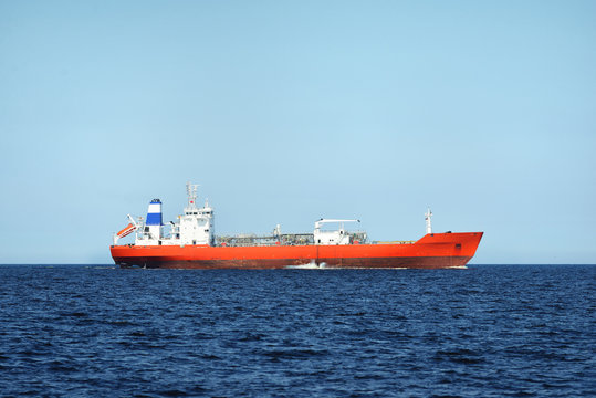 View of a red lpg tanker sailing in a open sea on a clear day