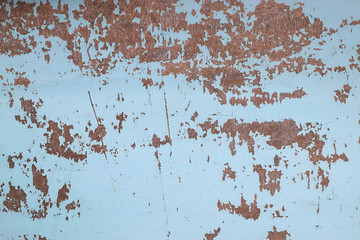 Eroded metal texture with black paint splashes, abstract grunge background