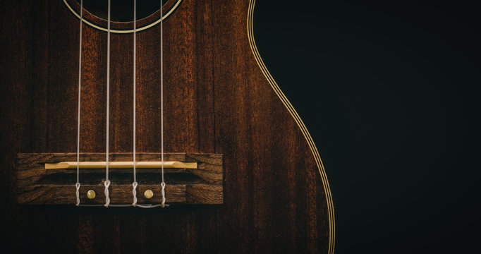 ukulele guitar,Vintage dark tone holiday relax break time with music or art concept with copy space