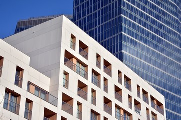 Obraz premium Fragment of modern residential apartment with flat buildings exterior. Detail of new luxury house and home complex. 