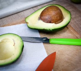 Avocado halves on the kitchen table