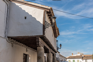 detail of old construction with gallery columns and lanterns in the city of Orgaz. Toledo province. Community of Castilla la Mancha