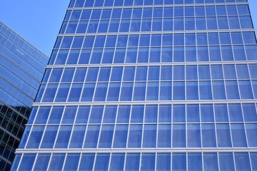 Abstract texture of blue glass modern building skyscrapers. Business background.