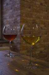 White and red wine in the glasses of a cafe