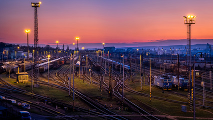 Brno / Czech Republic - Nov 30, 2019 - train station right after sunset in Brno Malomerice. With light towers and trains