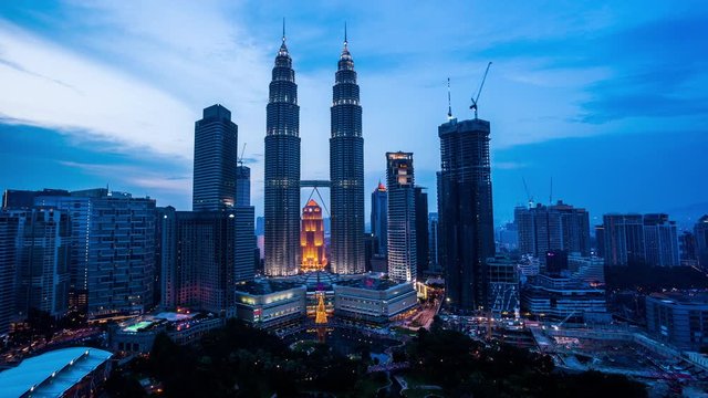 Petronas Twin Towers (KLCC) in Kuala lumpur day to night time lapse