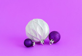 Christmas baubles on a purple background