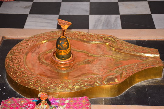 View of the Shiva lingam made of marble stone and brass in the temple of Lord of Shiva