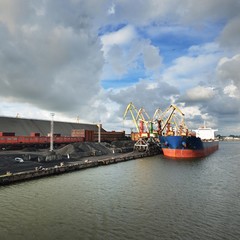 Large bulker ship loading coal in Ventspils free port