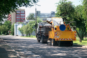 Sweeper machine in the process of cleaning the street.