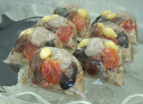 rice dumpling or Bajang in Thai language wrapped in a plastic bag and placed on a clear tray used for the Asian Dragon Boat Festival.