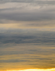 Beautiful pastel colored puffy clouds at sunset