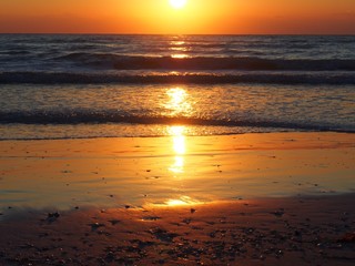 Fototapeta na wymiar Beautiful Sarasota Sunset with Light Reflected in Gulf Waves