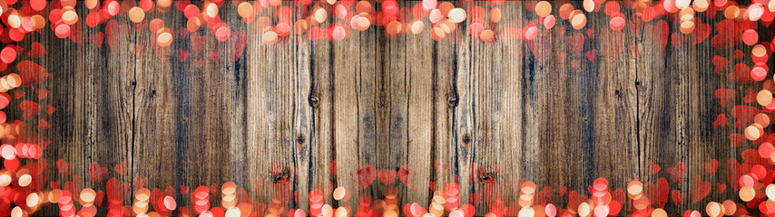 Valentine love background panorama banner long - Frame made of red bokeh lights and hearts isolated...