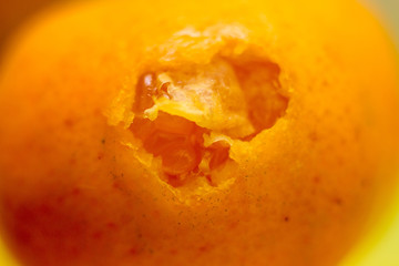 Bitten tangerine. Photo.