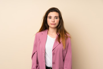Fototapeta premium Young brunette girl with blazer over isolated background with sad and depressed expression