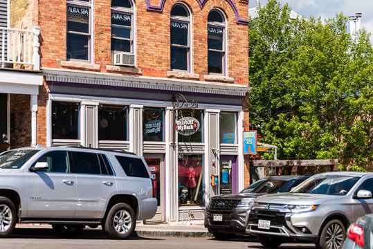 Park City, USA - July 25, 2019: Ski resort town in Utah during summer with downtown historic buildings sports store shop and cars