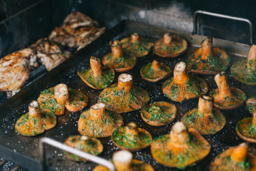 Close-up red pine mushroom and chicken at the barbeque. Seasonal food